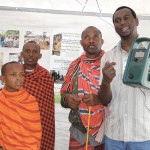 man holding crank-powered radio in Africa