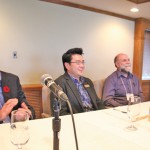 men seated at a conference table