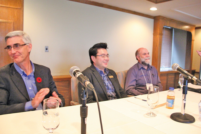 men seated at a conference table