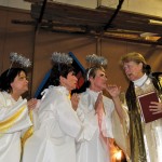 Angelic members of Headingley United Church (l to r) Candy Burke, Sandy Johnston and Cindy Ruth have an intense
conversation with ‘Pastor Penny’ played by Margaret Mills during the stagin g of Back to the Manger by the small
congregation November 30 in a congregation member’s farm shed.