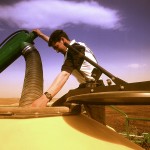 farmer loading grain truck with auger