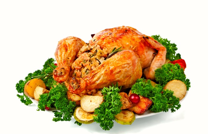 cooked turkey on a plate with vegetables