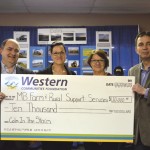 Janet Smith, program manager with Manitoba Farm and Rural Support Services and Leanne Brackenreed, councillor with Manitoba Farm and Rural Support Services accept the $10,000 donation from Derrall Farmer, managing partner with the Western Financial Group and Earl Martin, account executive with the Western Financial Group. [Martin (l to r), Smith, Brackenreed, Farmer]