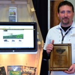 Chris Hawkins, managing director of AgChemExpert displays the plaque he was awarded after earning first place in the 2015 Inventor’s Showcase at the Manitoba Ag Days.