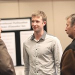 men talking in a group