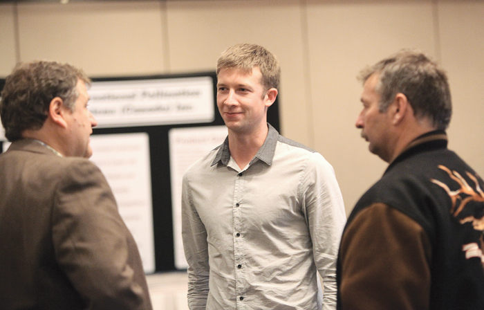 men talking in a group