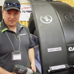 Eric Gray with his invention, FenderXtender at Manitoba Ag Days 2015