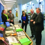 Minister of Tourism, Culture, Heritage, Sport and Consumer Protection Ron Lemieux (far right) and Manitoba Historical Society president Harry Duckworth eye a
display of the 27 local histories donated by the MHS to the Manitoba Legislative Library last week. Also pictured are assistant deputy minister Veronica Dyck, Jason Woloski, Manitoba Legislative Library’s head of collections and development and librarian Meghan Hansen.