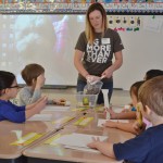 woman teaching children in a classroom