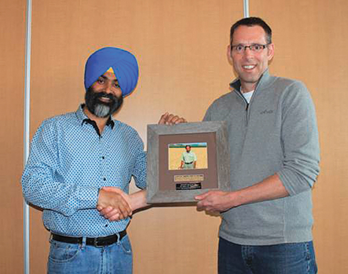 Harpinder S. Randhawa, current soft white breeder at AAFC, received the  Seed of the Year award on behalf of Sadash Sadasivaiah, who passed away in 2005. It was presented by award co-chair Todd Hyra.
