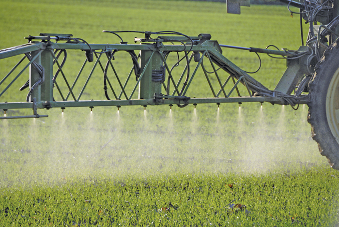 crop sprayer operating in the field