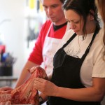 Talia Syrie examines a pig snout during a butchering seminar hosted by Food Matters Manitoba in Winnipeg last weekend.