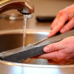 Andy Chamberlin of Spring Creek Farm sharpens a blade.