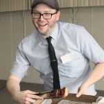 Jon McPhail, co-owner of Jonnies Sticky Buns in Winnipeg, enthusiastically shows off his wares.