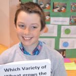 young boy with science project