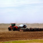 tractor seeding in a field