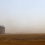 soil blowing across a farm field