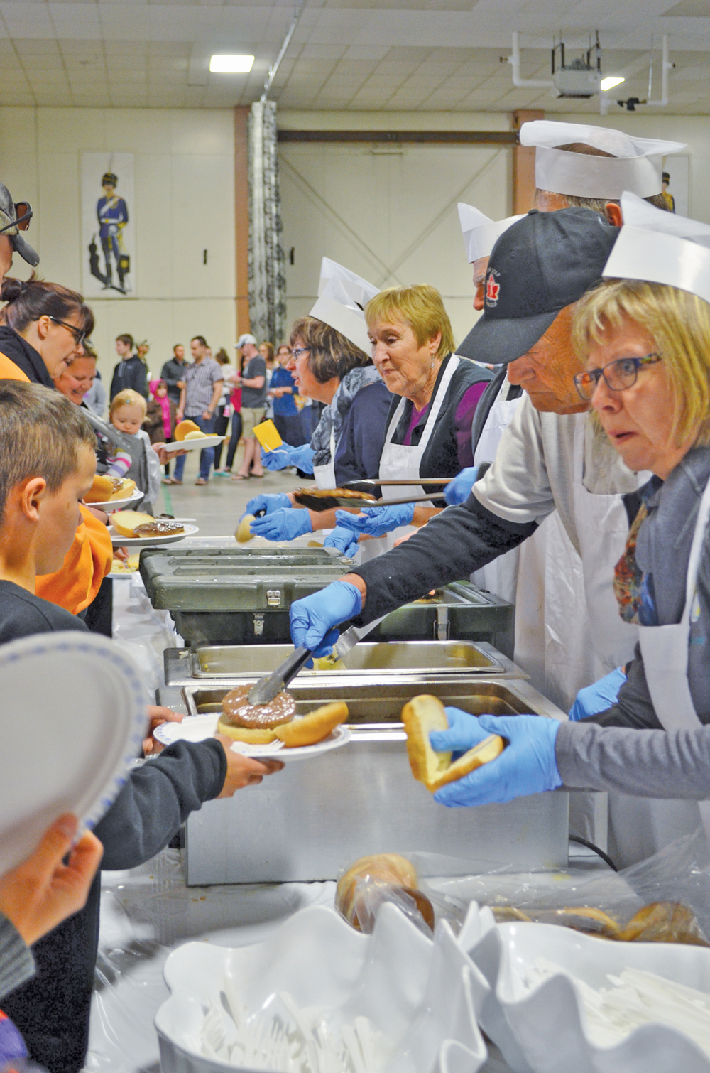 Volunteers along with a number of cattle industry members participated in serving up Canadian beef to military families at CFB Shilo.