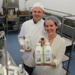 man and woman in dairy facility