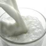 milk pouring into a glass