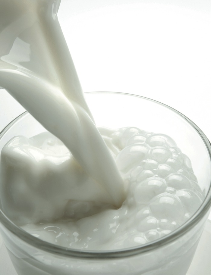 milk pouring into a glass