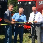Ag in Motion was officially opened with a ribbon-cutting by (l-r) Glacier Media Group president and CEO Jon Kennedy, federal Agriculture Minister Gerry Ritz and Saskatchewan Agriculture Minister Lyle Stewart.