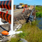 The tornado chewed up pavement along the edge of a bridge on highway 256, east of Tilston.