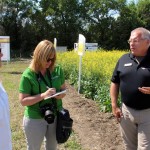 There is always something new out there…The Ag In Motion farm show near Saskatoon this week was the “Pot of Gold” in terms of discovering what is new or is coming down the pipeline with new farm machinery, production technology and advances in crop development. Above, Leeann Minogue, editor of Grainews interviews, centre, talks with Kent Gulash, district sales manager with Dow AgroSciences about new DAS canola varieties that are entering the market this year, as well as other leading hybrid varieties still in development. Looking on is Loralee Orr, DAS communications leader.