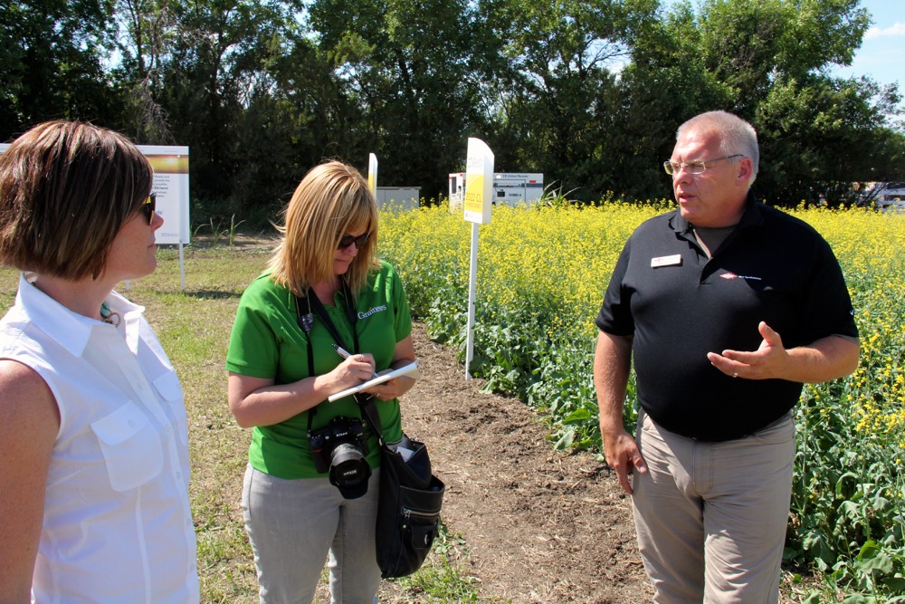 There is always something new out there…The Ag In Motion farm show near Saskatoon this week was the “Pot of Gold” in terms of discovering what is new or is coming down the pipeline with new farm machinery, production technology and advances in crop development. Above, Leeann Minogue, editor of Grainews interviews, centre, talks with Kent Gulash, district sales manager with Dow AgroSciences about new DAS canola varieties that are entering the market this year, as well as other leading hybrid varieties still in development. Looking on is Loralee Orr, DAS communications leader.