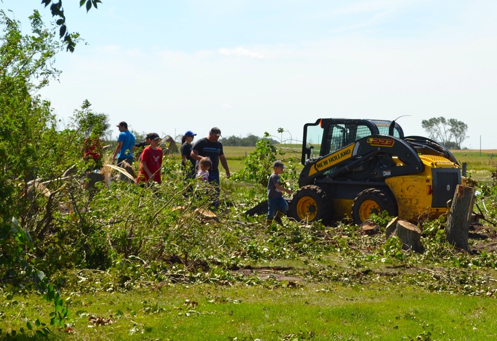 Fred and Anne Raynor’s children and grandchildren worked to clean up after the storm on Wednesday afternoon.