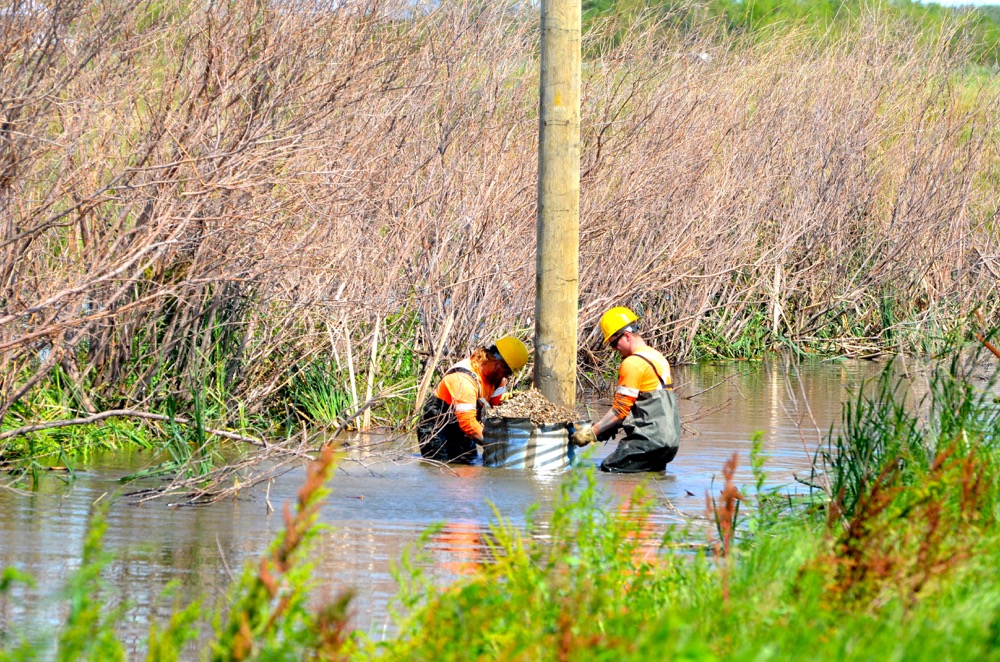 Manitoba Hydro crews worked through some soggy conditions along highway 256 as they restored power to the area’s residents.