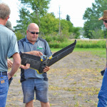 Jeffery Kostuik (centre), diversification specialist with Parkland Crop Diversification Foundation, demonstrated his SenseFly eBee fixed-wing drone at the Westman Agriculture Diversification Organization’s (WADO) field day in Melita on July 21.