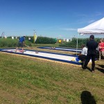 DuPont Pioneer’s booth includes an outdoor “rink” and the chance to throw a rock with two-time Brier champion Pat Simmons.