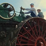 Bruce Eberling (l) and Colin Farquhar operate the 65-hp 1916 Case steam traction engine powering the threshing machine.