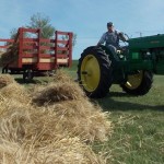 A 1951 Deere MT pulls the wagon.