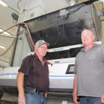 Dale Alderson (l) and Don Campbell of Intel Seed beside the company’s seven-chute AMVT optical sorter.