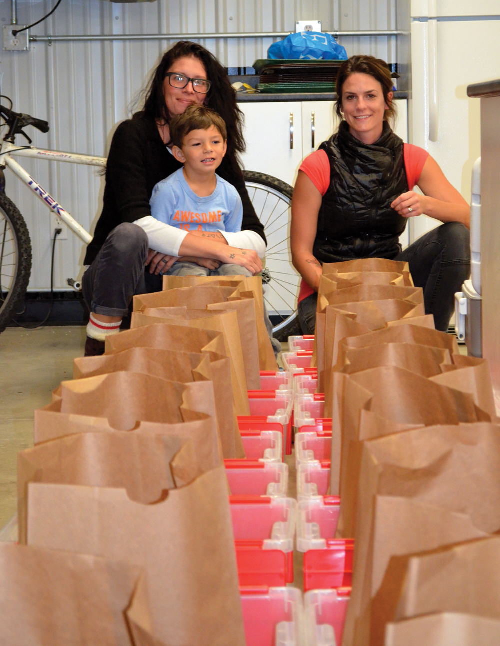 Erin Gobeil (l) with her son, Kal-El and Nikki Dean (r) have volunteered to help run the Good Food Box pilot project.