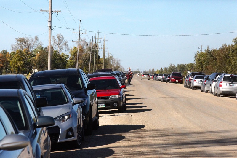 Cars line the roadway as visitors take in Open Farm Day.