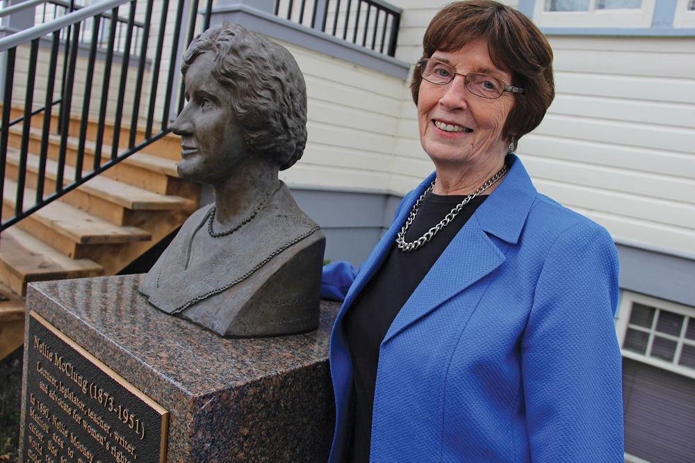 Manitou resident and history teacher Bette Mueller, next to the bust of Nellie McClung located on the grounds of the Manitou Opera House, is part of the Nellie McClung Foundation, a group raising awareness through educational events and resources about the contributions of the famous right-to-vote leader. McClung lived in Manitou until 1911 where she wrote the first of her 16 books, Sowing Seeds in Danny, and began her lifelong dedication to improving the political and social well-being of women. 