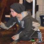 Baxter Blair, age 13, of McLean, Sask., gets busy grooming as he prepares for his turn in the ring at the 2015 Manitoba Ag Ex.