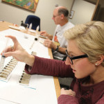 Manitoba Soil Science Society member Marla Riekman carefully encases in resin the tiny layers of Newdale Clay Loam she and colleague
John Heard scoop into metal findings to create a unique series of jewelry made with Manitoba’s provincial soil.