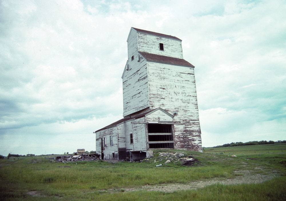 This elevator, built in 1928 for the Moline Co-operative Elevator Association No. 127, closed in December 1978 when the adjacent CNR line was abandoned. It stood vacant until at least the early 1990s before being removed from the site.