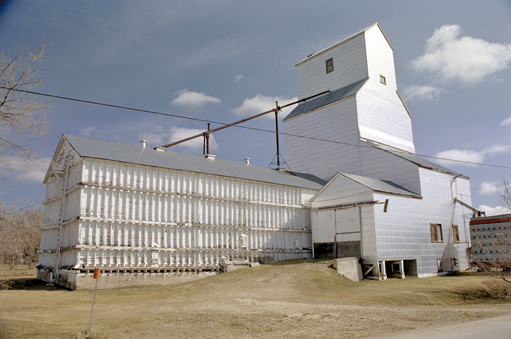 The former Manitoba Pool elevator and annex at Tyndall in the RM of Brokenhead closed in July 1971  and were used for over 40 years by a livestock feed dealer. They are still standing.