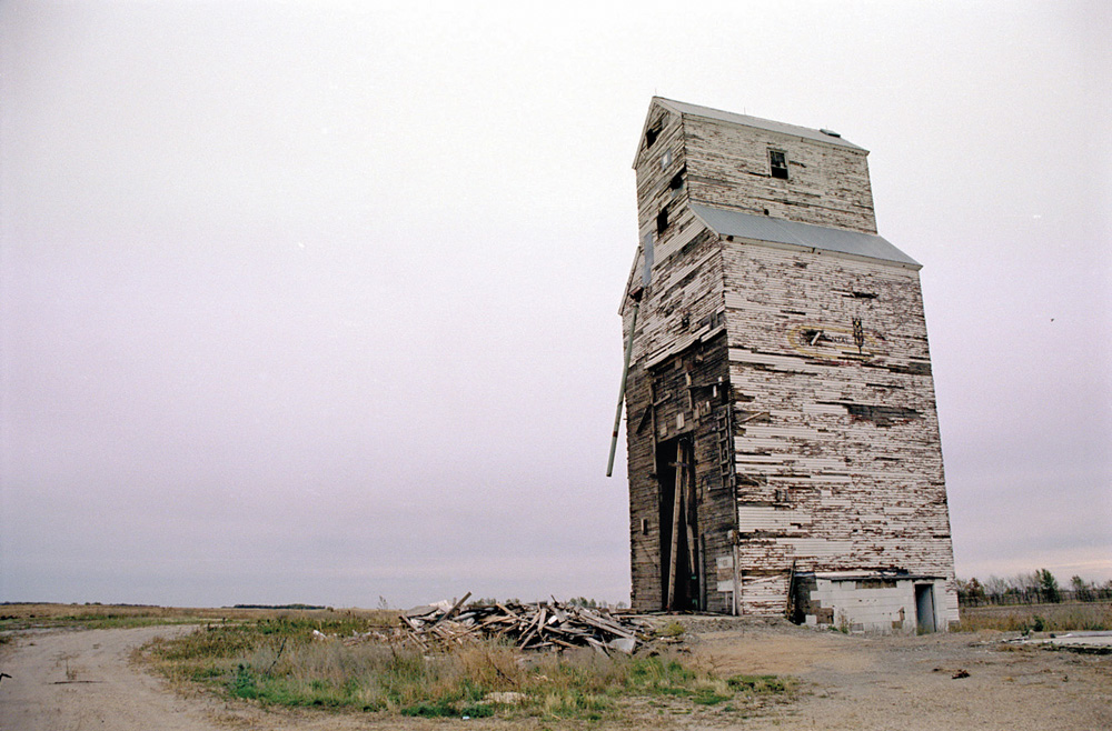 Deerwood — In 1959, a 28,000-bushel elevator at the Deerwood siding in the RM of Thompson was purchased by UGG from the Canadian Consolidated Grain Company. It closed in July 1970 and, four years later, was sold to a specialty seed producer. It was demolished in October 2003.