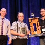 men receiving award for growing corn
