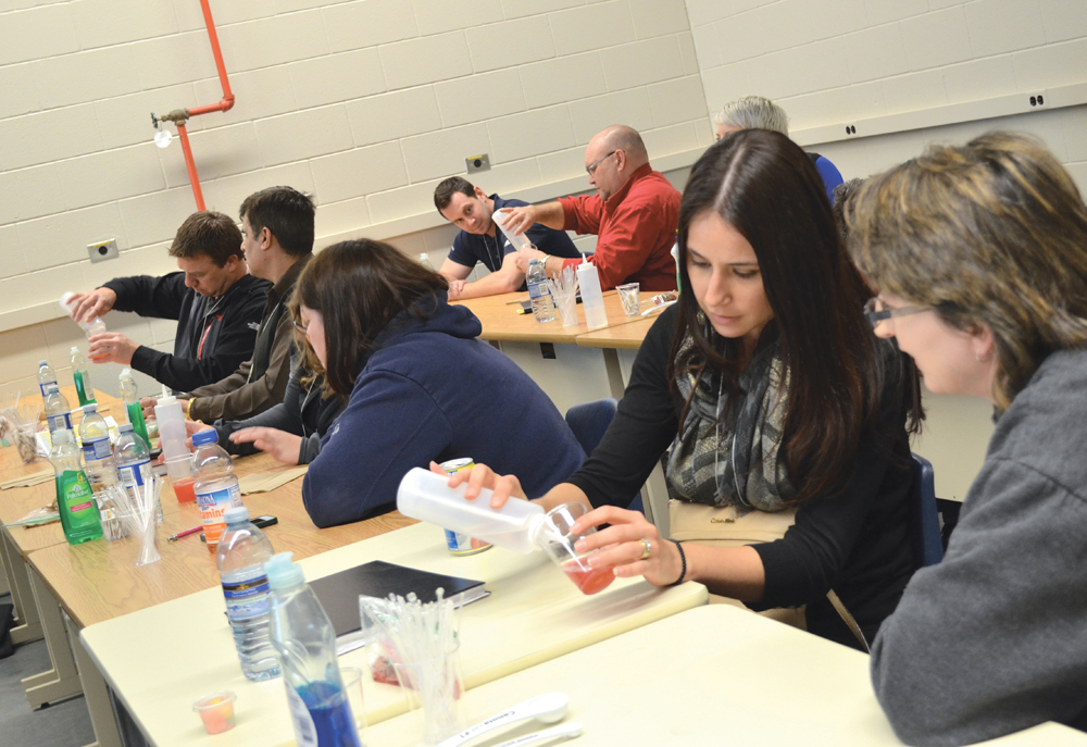 CanoLAB participants worked through an exercise of extracting the DNA from a strawberry to get a better understanding of how canola diagnostics work.