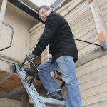Danny Mann, professor and head of the department of biosystems engineering at University of Manitoba stands on the mock-up staircase built at the university so researchers could compare access paths on farm equipment, including the steps, angles and spacing and how different designs impacted knee joints of users.