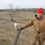 Eighty-two-year-old Thornhill farmer David Lumgair, pictured here with his farm dog Rodger, says fossil discoveries on his farm over the years have made him think about the future of life on earth too.