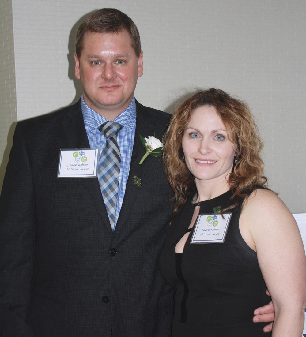Outstanding young farmers Jason and Laura Kehler received their plaque from Manitoba Agriculture, Food and Rural Development Deputy Minister Dori Gingera-Beauchemin.  