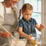 mother and daughter cooking